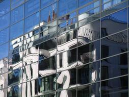 Glass reflecting the neighboring building