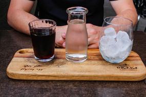 refreshing cold drink and a glass of ice