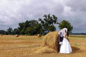 of couples in the wedding field