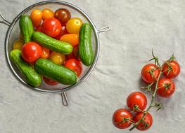 Delicious and ripe tomatoes and cucumbers in a plate