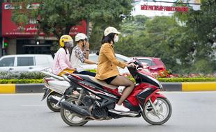 people riding a motorcycle