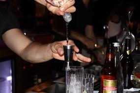 bartender with alcoholic beverages