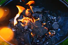 burning fire on coals in a campfire