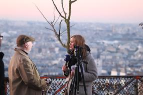 a female photographer and a male