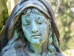 girl sculpture face cemetery