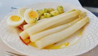 Tasty asparagus with boiled eggs and potatoes