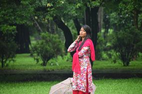 Girl with umbrella in park