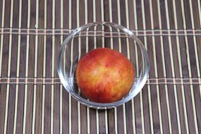 sweet peach in a glass plate