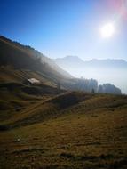 a landscape of bright sunshine and fields