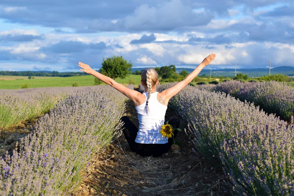 a girl in a white t shirt in the field
