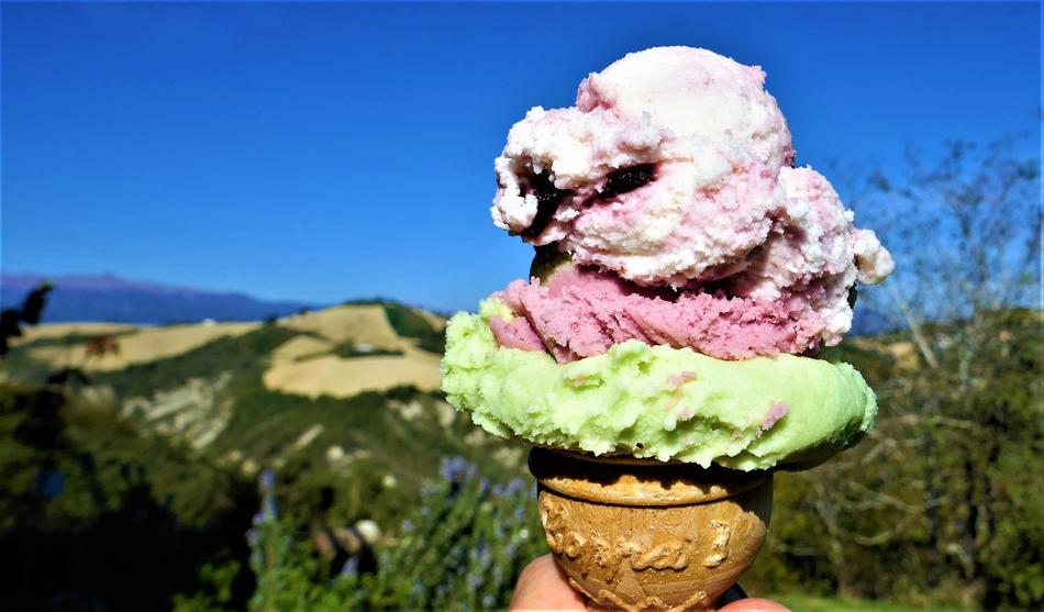 sweet ice cream in a waffle cone in the hand