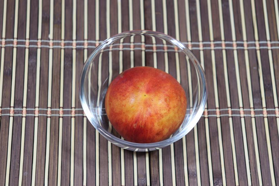 sweet peach in a glass plate