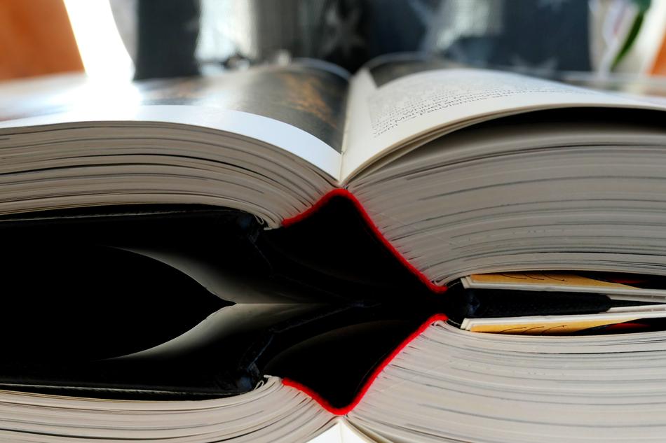 Colorful, open book with the images, with the reflections