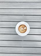 hot coffee with a pattern in a white mug