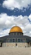 golden dome against the clouds