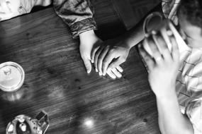 cute couple holding hands in a cafe