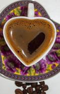 hot mug of coffee in the shape of a heart
