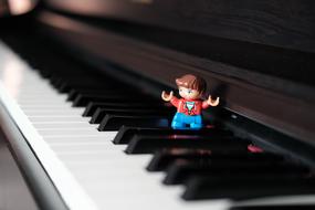 Lego man on the piano keys