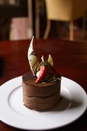 Chocolate dessert with strawberries on a plate