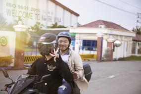 happy friends on a motorcycle