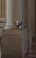 bouquet of roses by the column