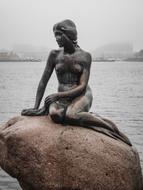 mermaid sculpture on a rock