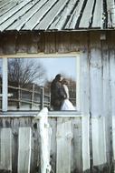 a wooden house with a wedding couple