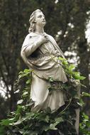 stone sculpture with leaves