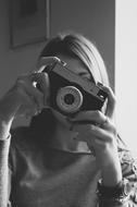 monochrome Photo of Girl with vintage camera