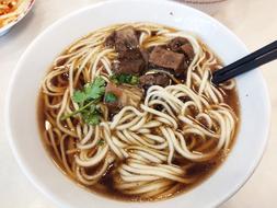 delicious noodles with meat and broth