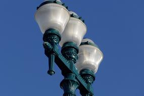 Landscape of the green lantern with the light bulbs, at blue sky on background