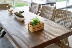 wooden table decorated with flowers and snacks