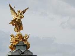 golden angel statue on the roof