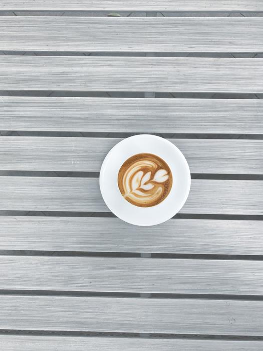 hot coffee with a pattern in a white mug