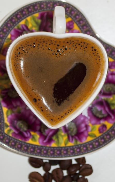 hot mug of coffee in the shape of a heart