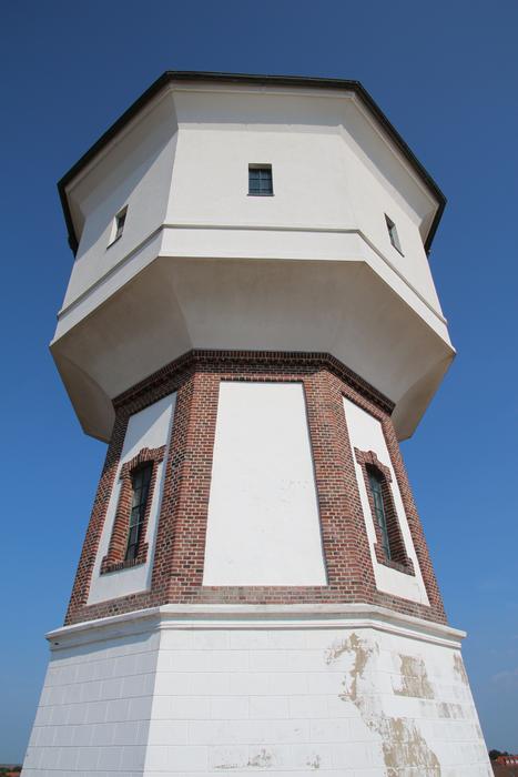 stone lighthouse in the blue sky