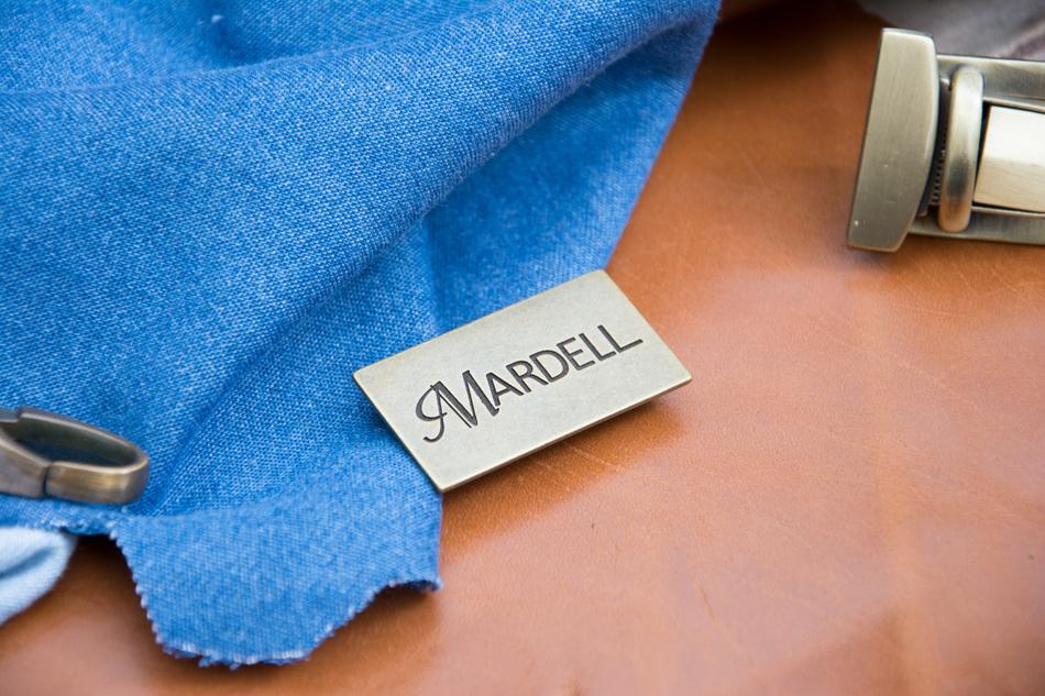 the tag on the blue sweatshirt