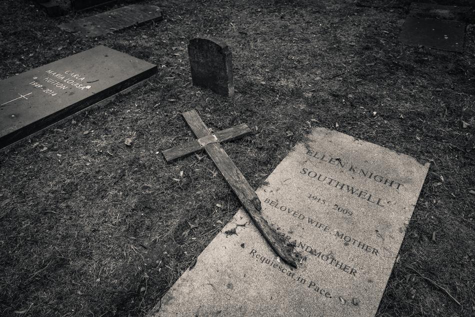 cross on a grave in a cemetery