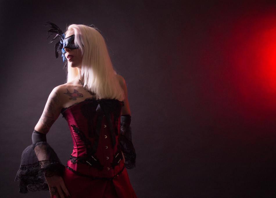 the girl in the mask and the dress