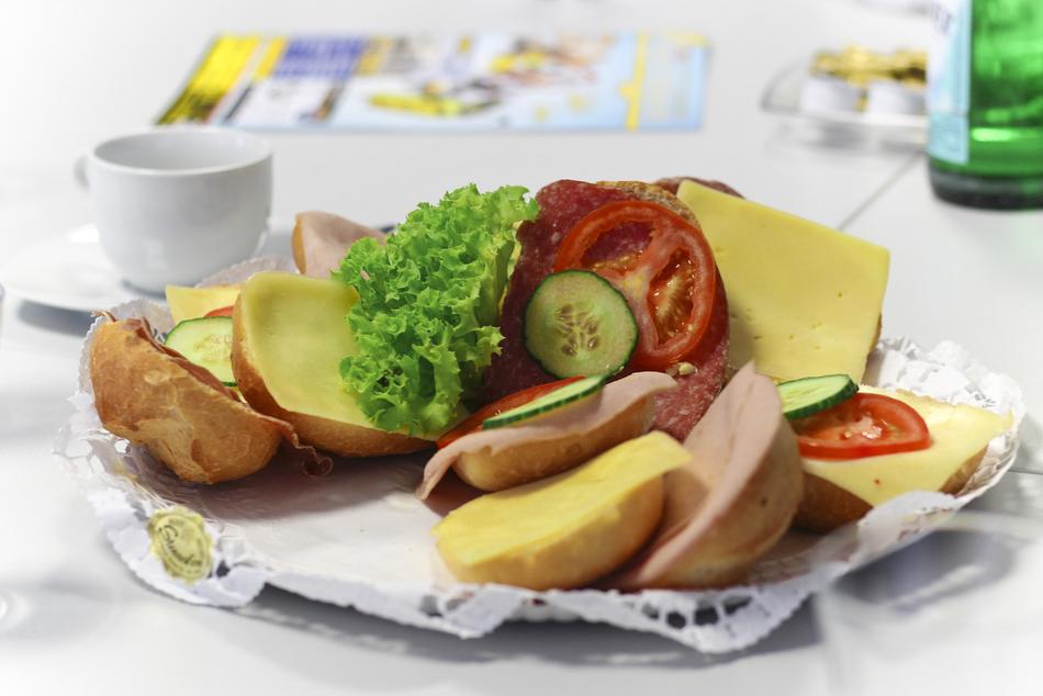 dish of vegetables and cheese with bread