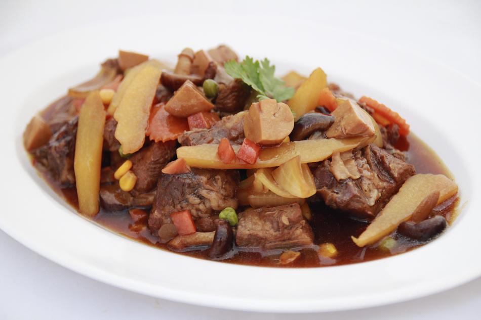 delicious pork with vegetables in sauce