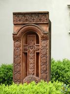 wooden cross in the bushes