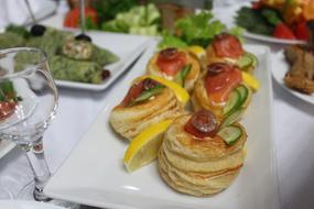 delicious baked goods with vegetables on a plate