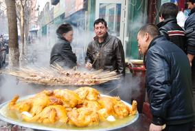 people eat at a street cafe
