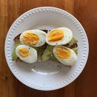 Boiled eggs with bread and avocado