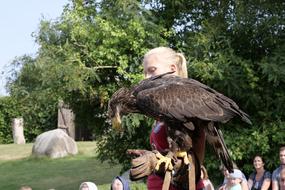 girl with an eagle on her shoulder