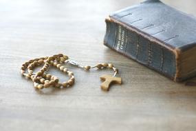 cross rosary book paper