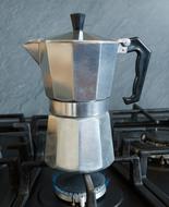 Iron kettle for brewing coffee on the stove