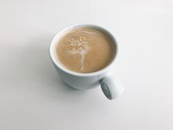 sweet coffee with a tree pattern