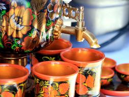 colorful samovar with mugs
